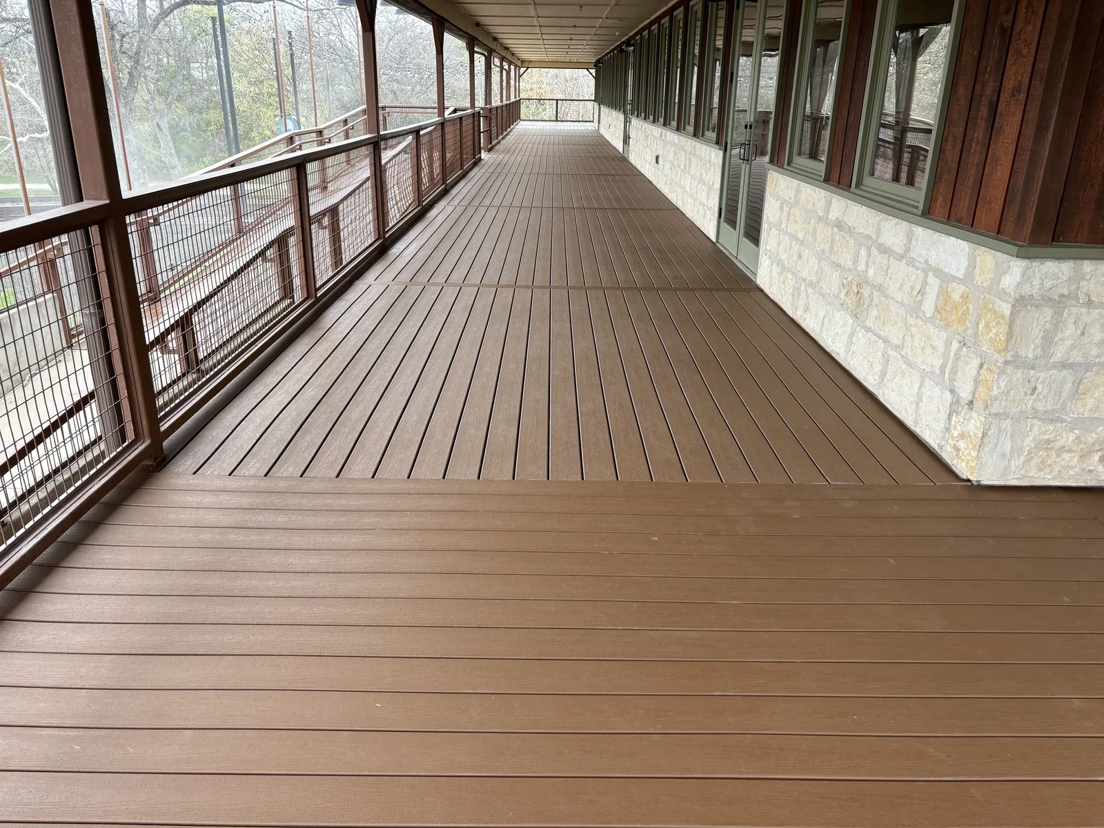 Composite decking laid down the length of a long covered porch